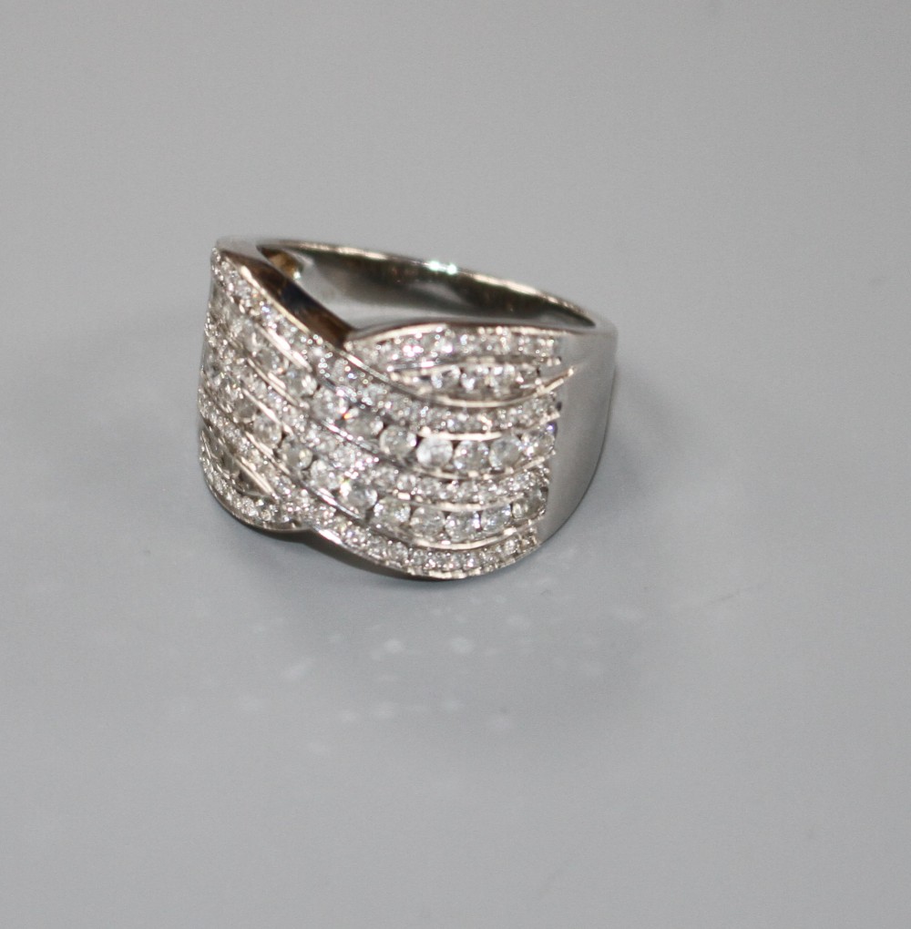 A modern 18ct white gold and pave set diamond crossover dress ring, with a total diamond weight of 1.00ct, gross weight 8.9 grams.